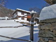 This winter scene features a charming traditional Bulgarian house with authentic wooden and stone craftsmanship, nestled in the serene Central Balkan Mountains. Surrounded by snow-covered landscapes, the house exudes a cozy, winter atmosphere.